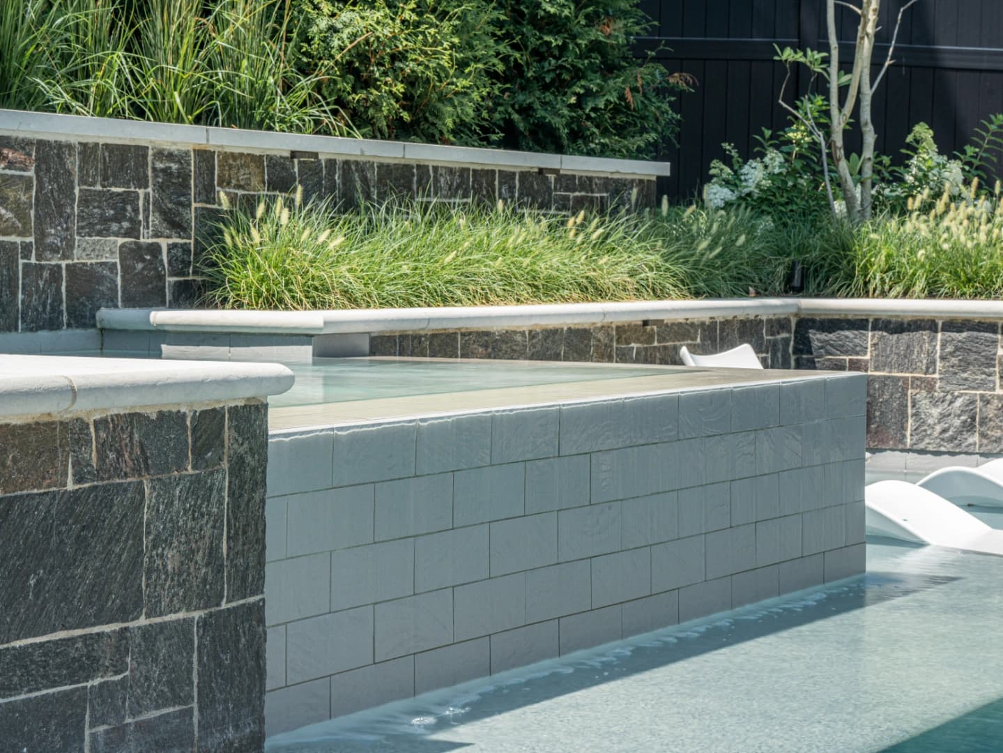 Close-up detail of luxury outdoor craftsmanship showing precision construction quality managed by Redwood